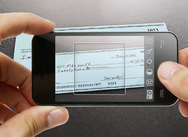 A smart phone taking a picture of a check for mobile deposit.