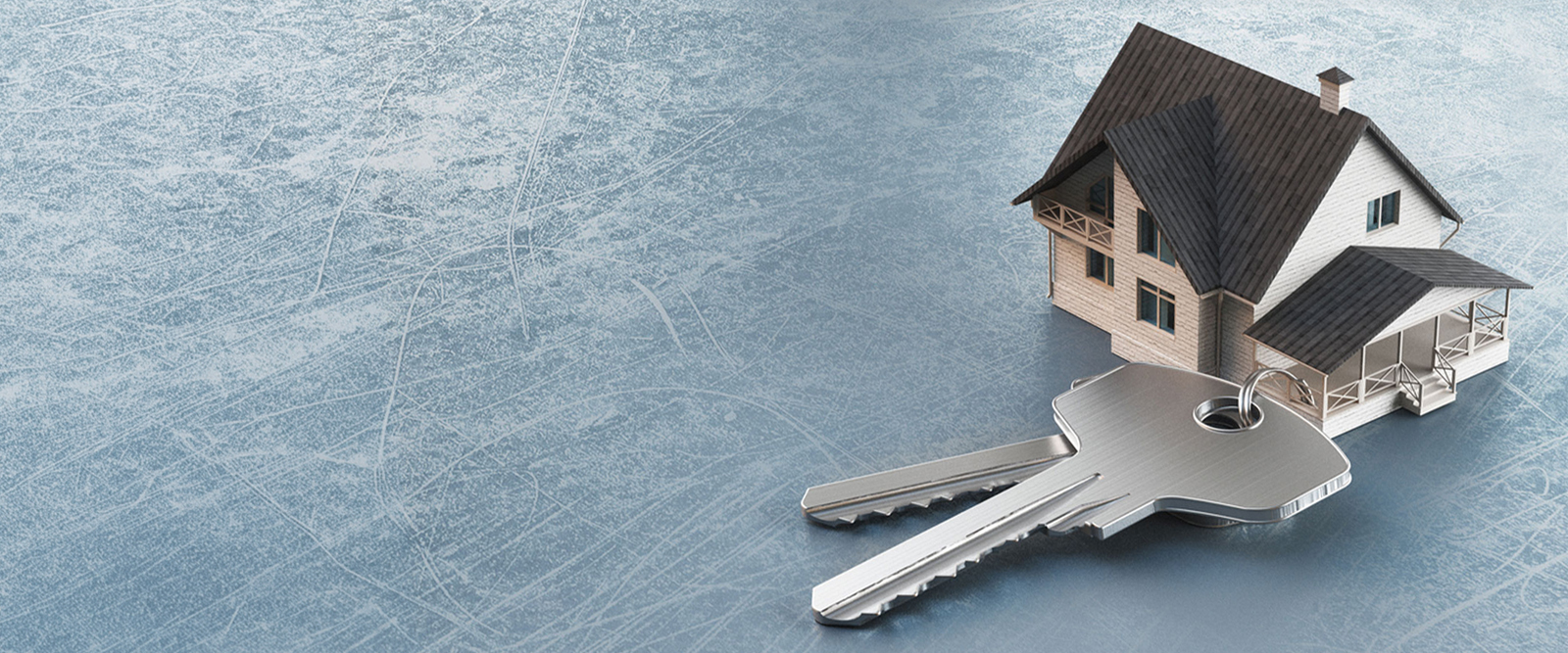 A toy house with a set of keys next to it.